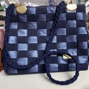 Beautiful blue purse with basket weave pattern and golden hardware